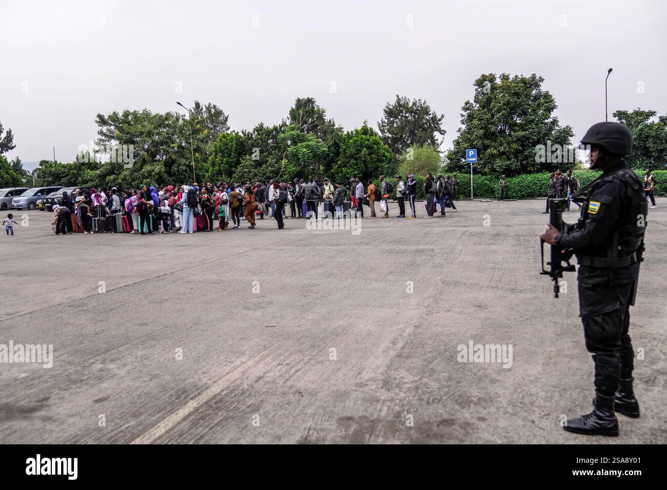Rwanda security officials check people crossing from Congo in Gisenyi