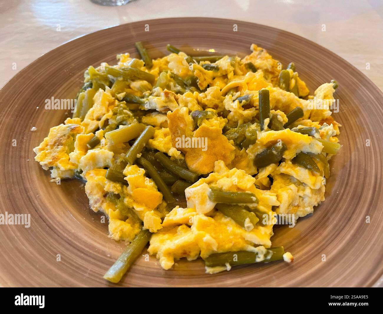 Scrambled eggs with green asparagus. Spain. - Smartphone Captured Stock Image