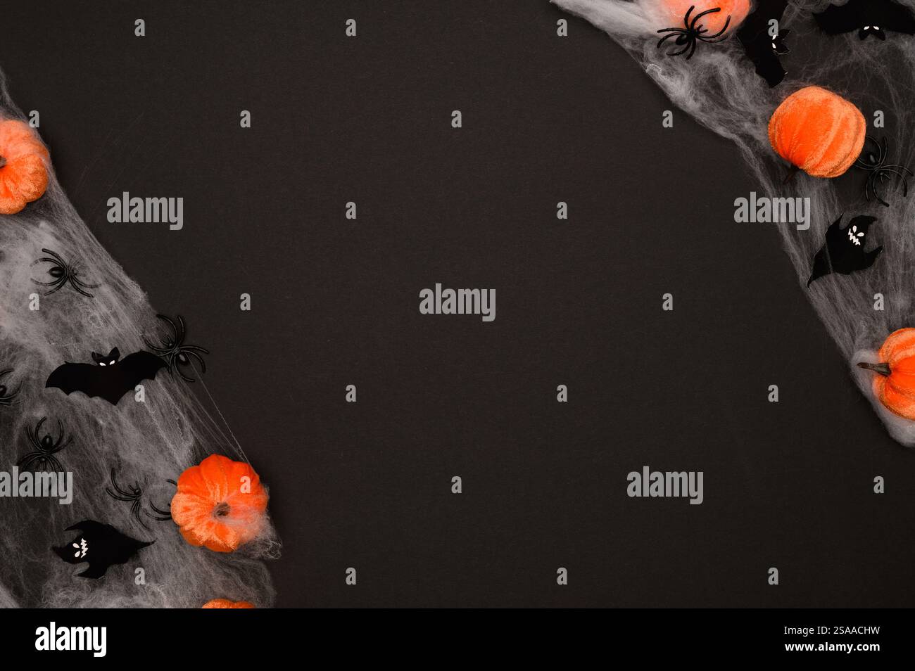 Layout of Halloween decorations on a black background: orange pumpkins ...