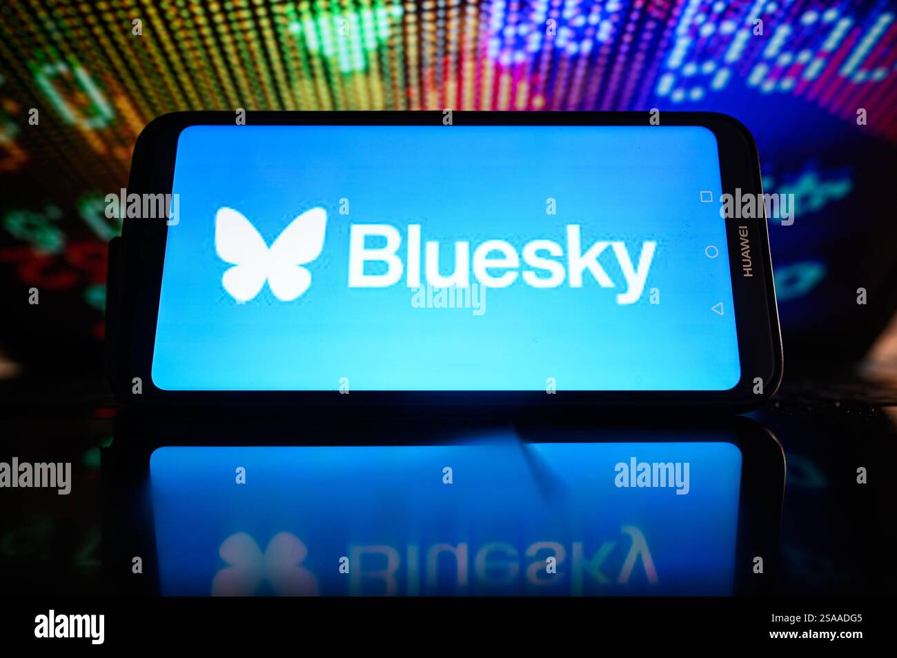 In this photo illustration, the Bluesky logo is displayed on a