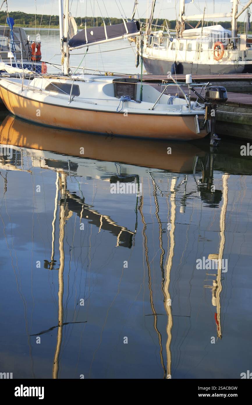 Boats are reflected in the water Stock Photo - Alamy
