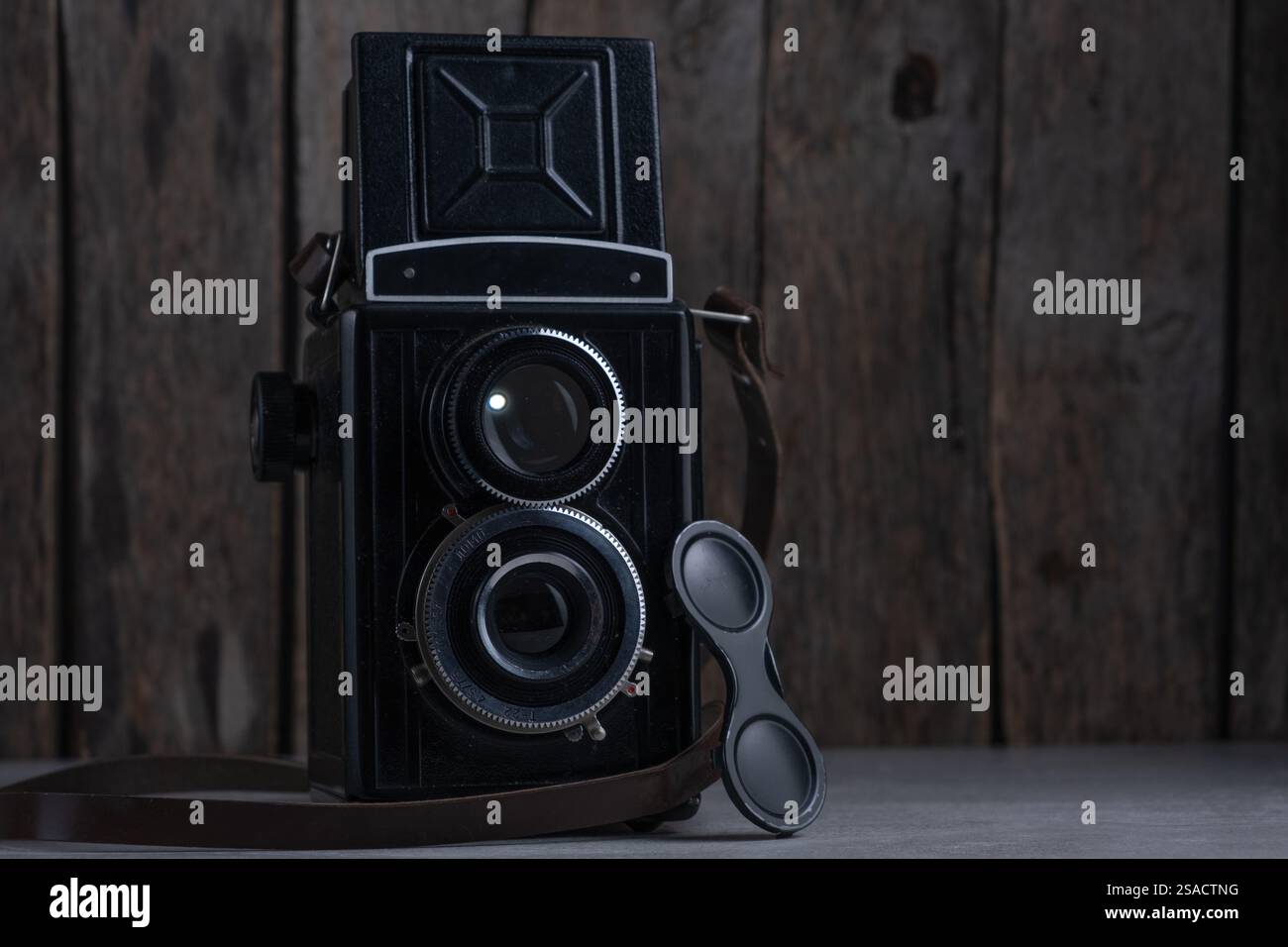 Old vintage camera on wooden background Stock Photo