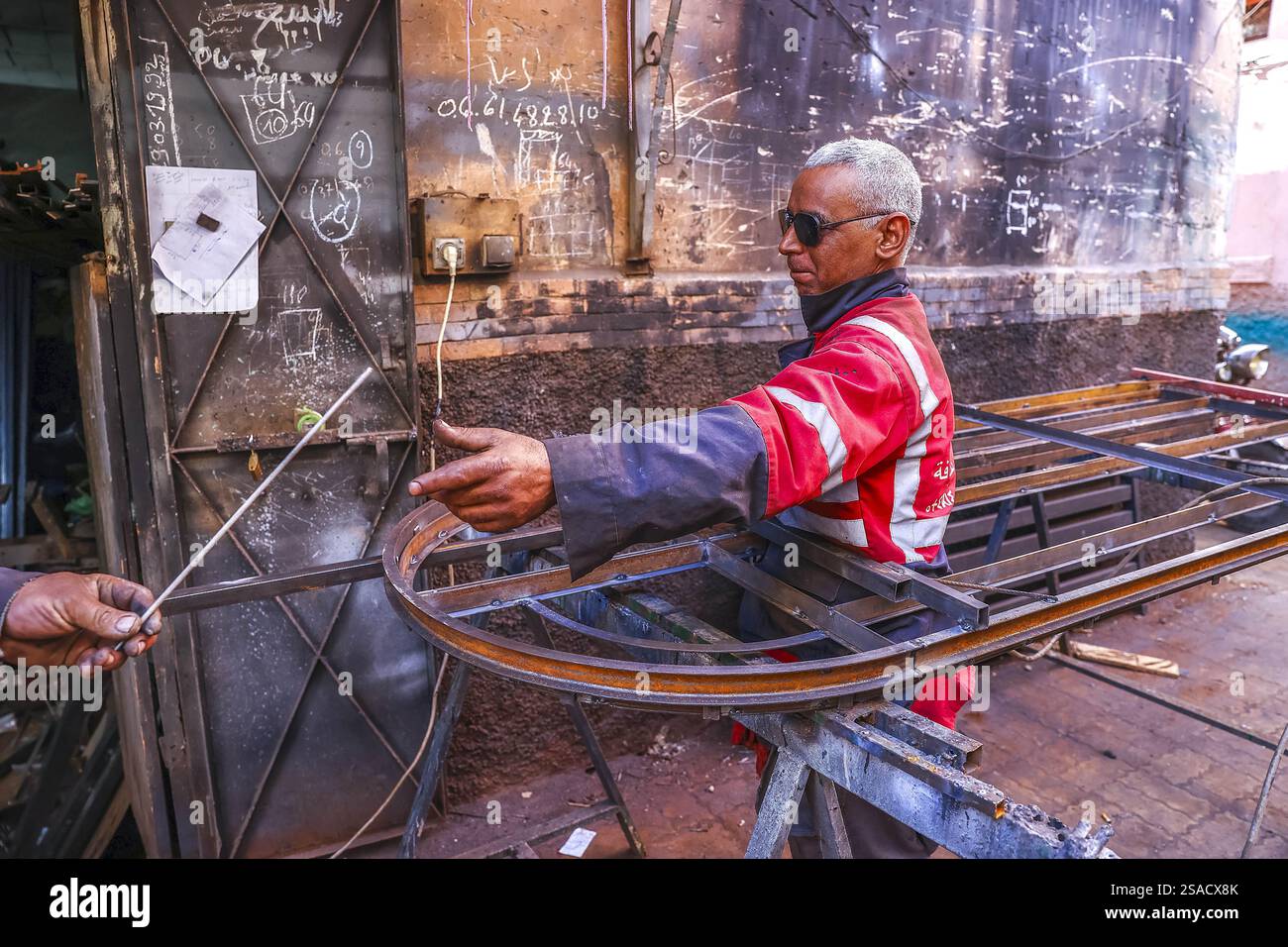 Welder at work in a workshop in Marrakesh, Morocco Stock Photo