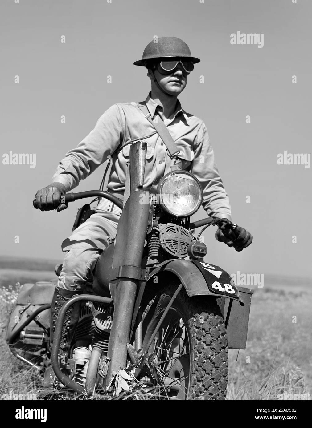 Motorcyclist serving as messenger for his platoon of the mechanized cavalry reconnaissance unit, Fort Riley, Kansas, USA, Jack Delano, U.S. Office of War Information, April 1942 Stock Photo