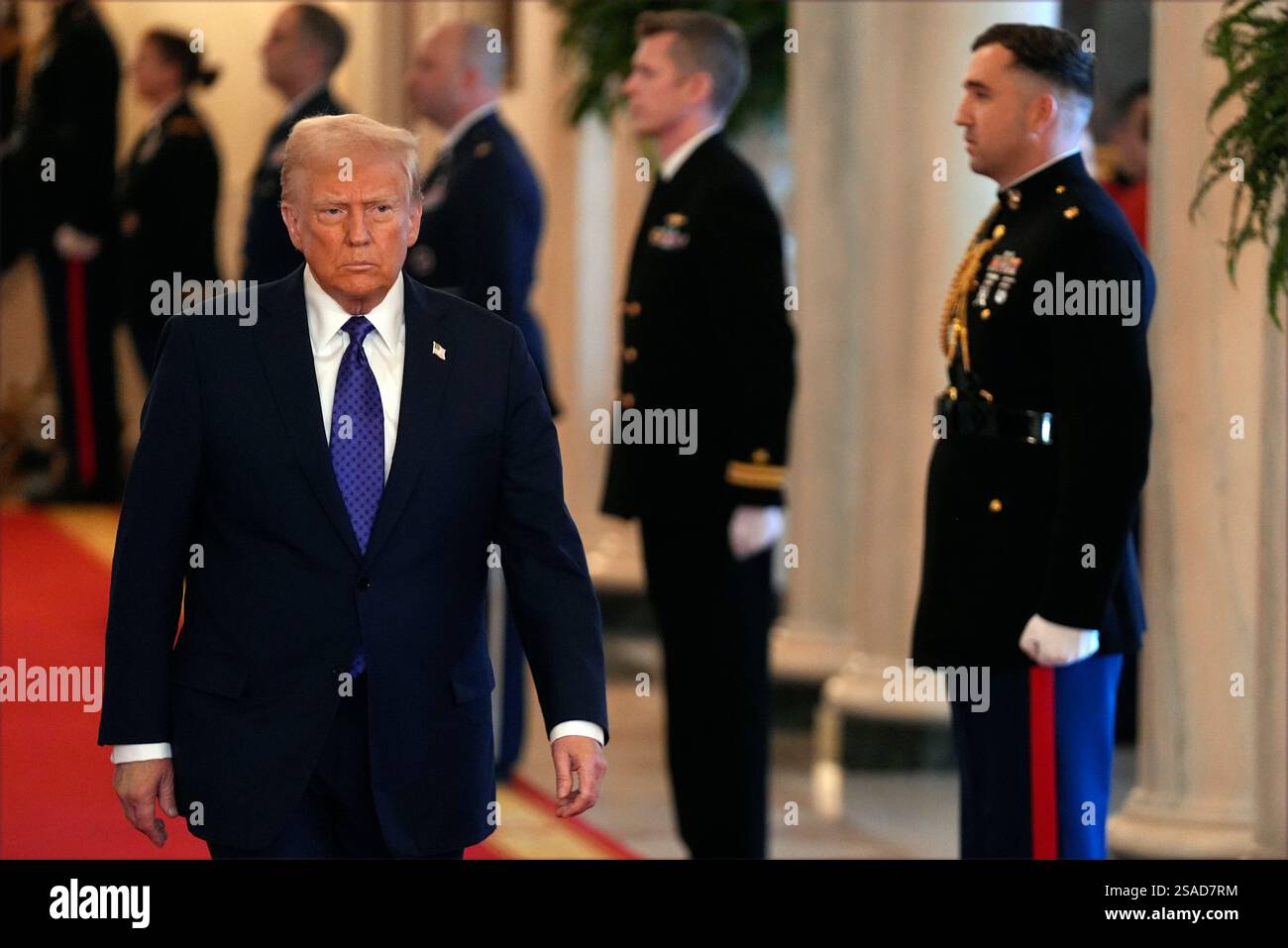 President Donald Trump arrives to sign the Laken Riley Act in the East ...