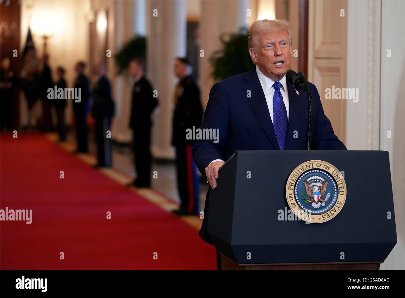 President Donald Trump speaks before signing the Laken Riley Act in the ...