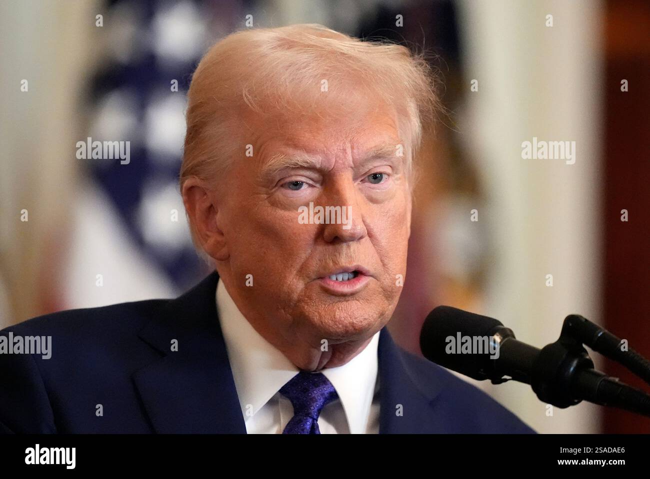 President Donald Trump speaks before signing the Laken Riley Act in the ...