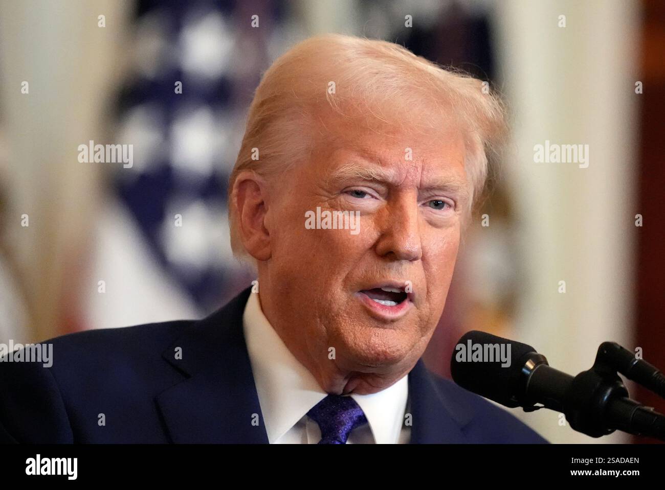 President Donald Trump speaks before signing the Laken Riley Act in the ...