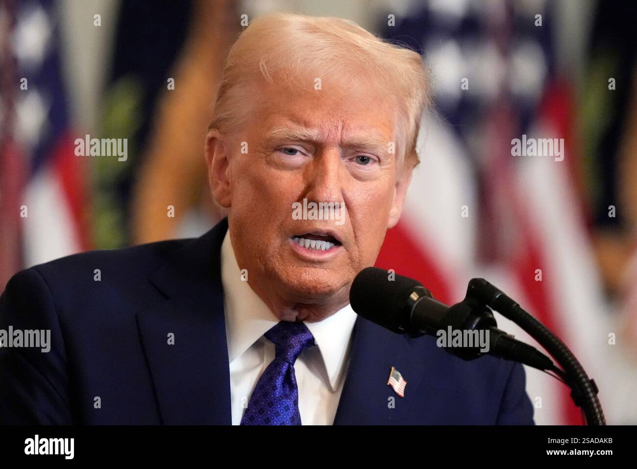 President Donald Trump speaks before signing the Laken Riley Act in the ...