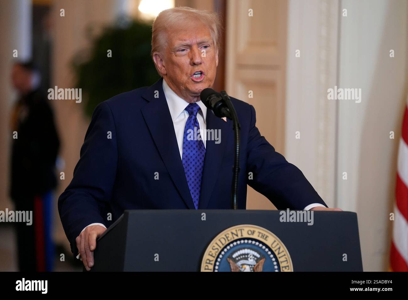 President Donald Trump speaks before signing the Laken Riley Act in the ...