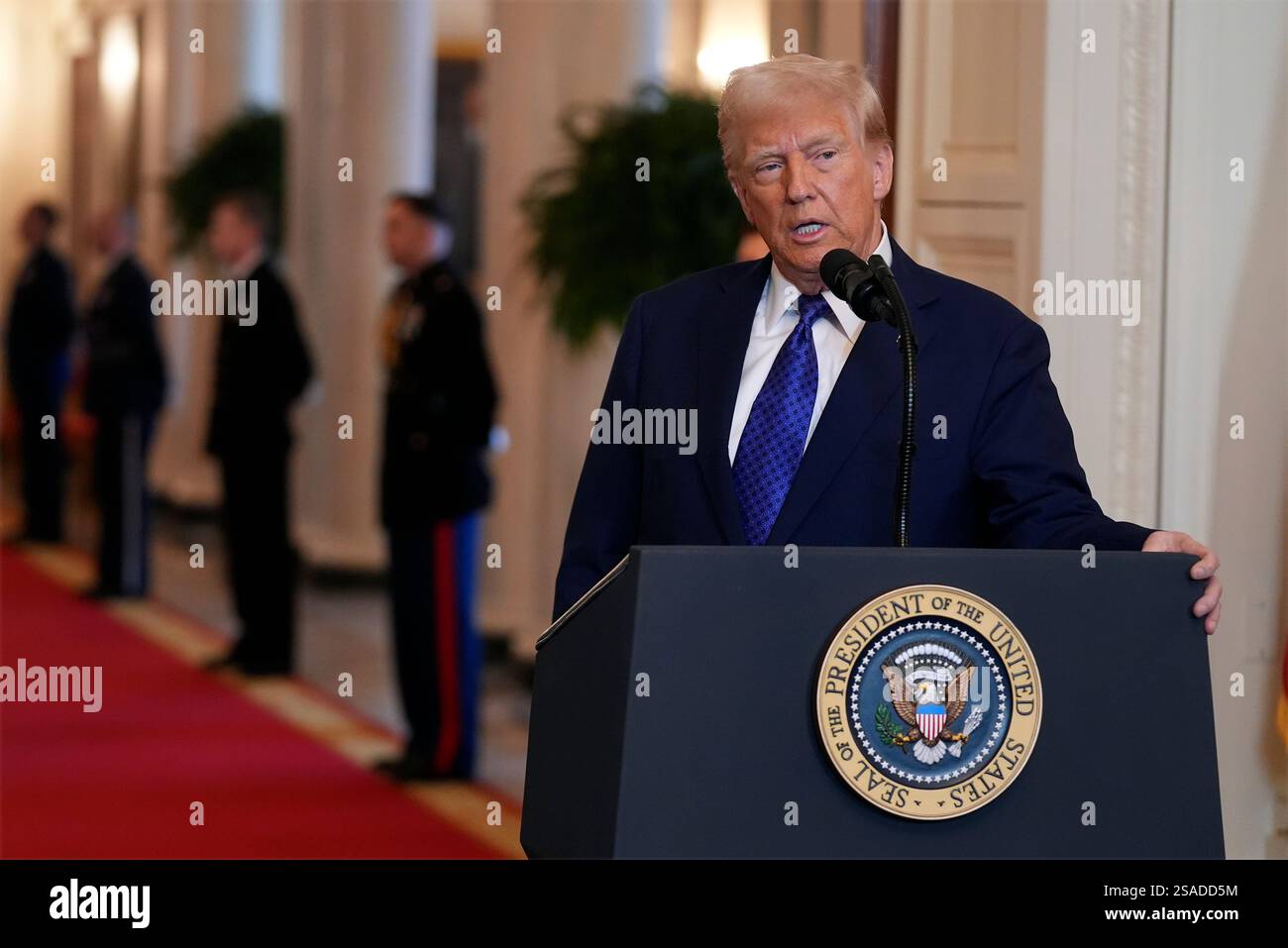 President Donald Trump speaks before signing the Laken Riley Act in the ...
