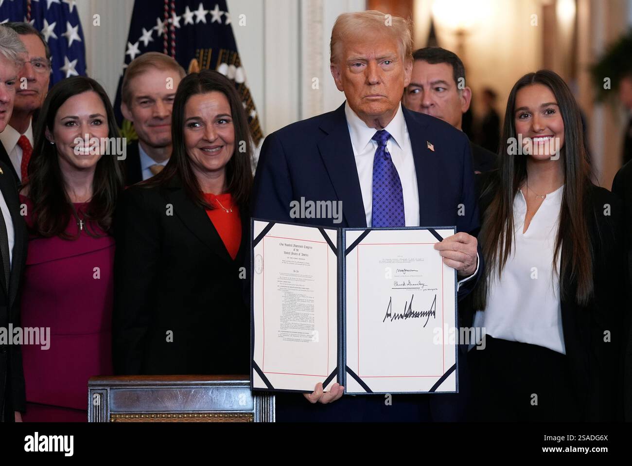 President Donald Trump poses after signing the Laken Riley Act during ...