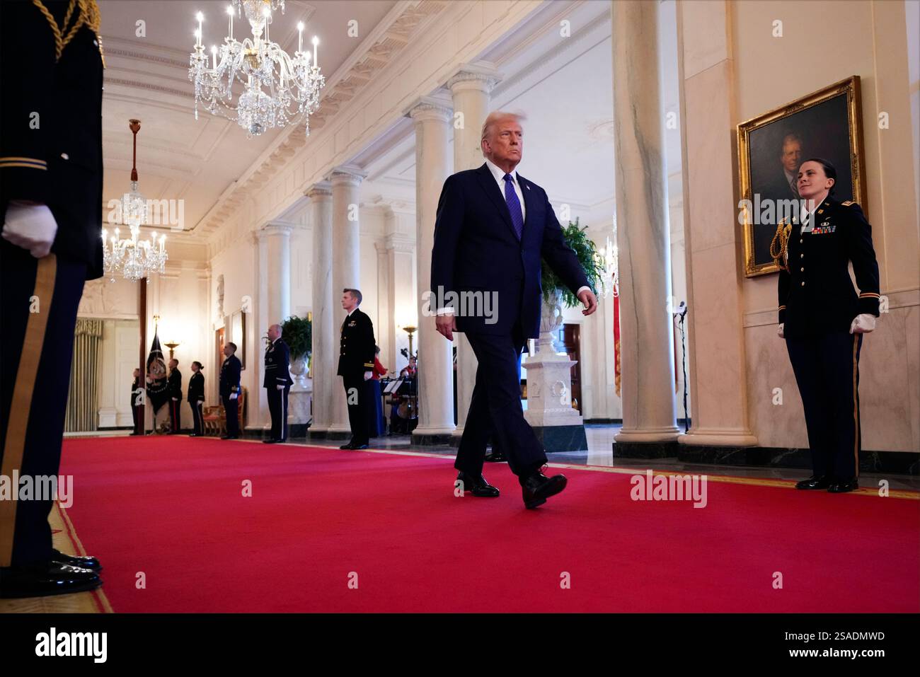 President Donald Trump arrives before signing the Laken Riley Act in ...