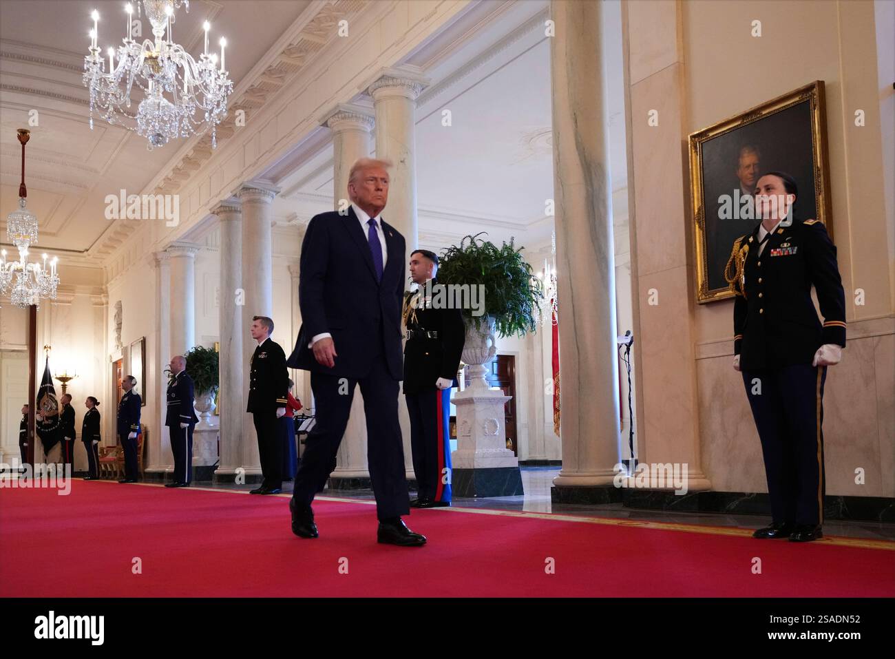 President Donald Trump arrives before signing the Laken Riley Act in ...