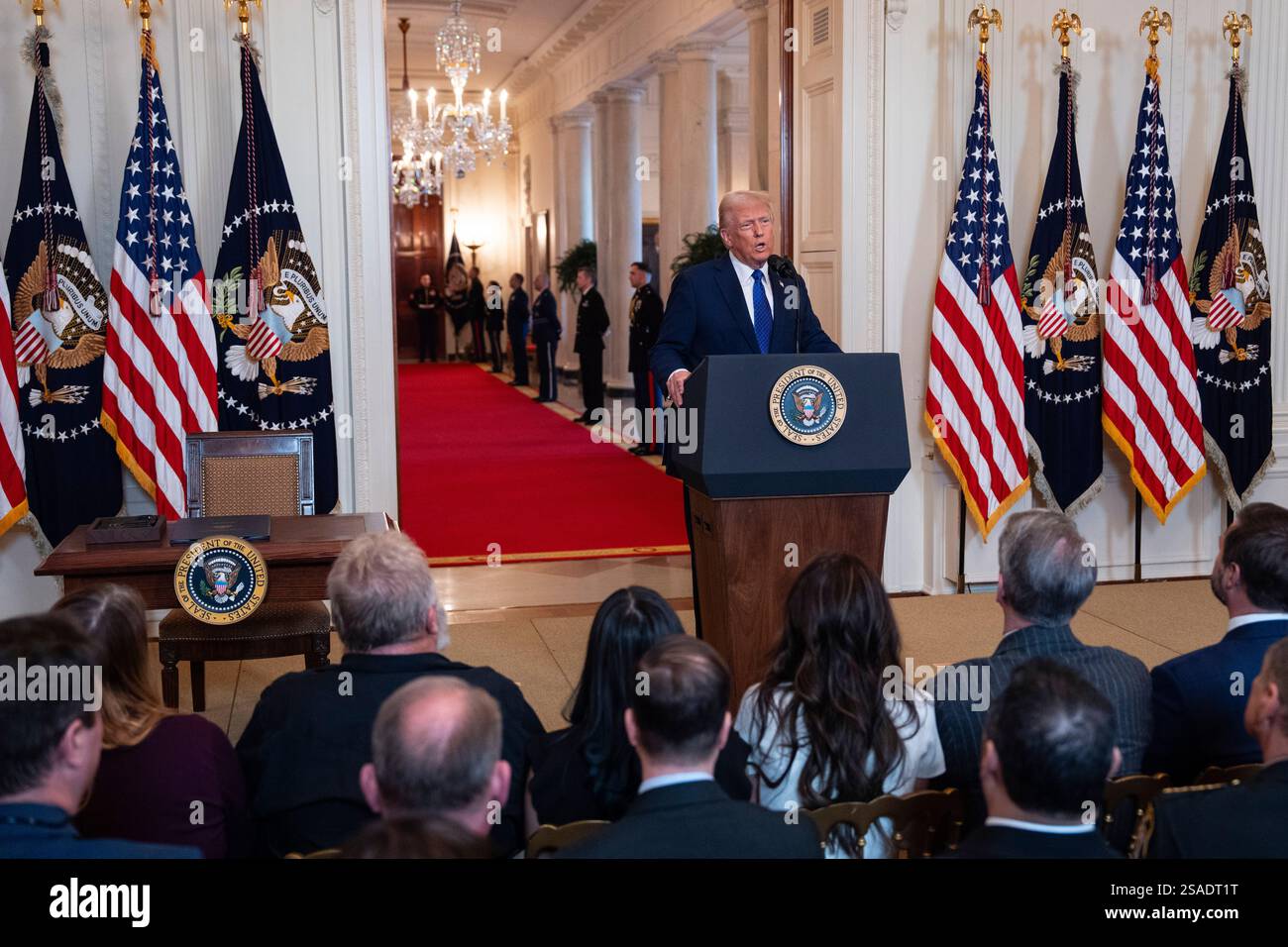 President Donald Trump speaks before signing the Laken Riley Act in the ...