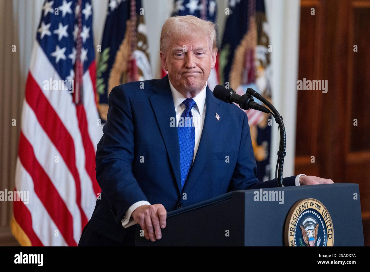 US President Donald Trump speaks before signing the Laken Riley Act in ...