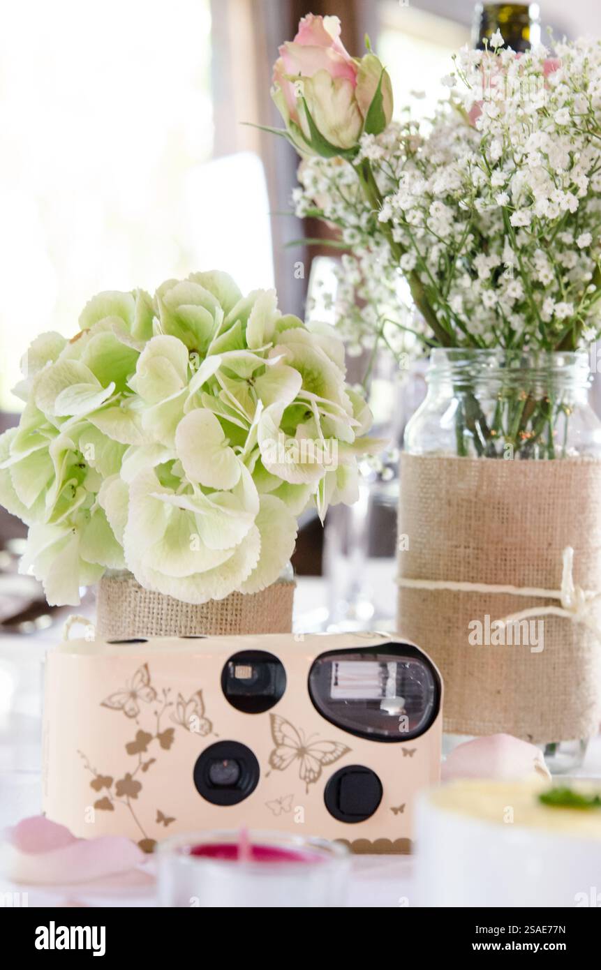 Wedding table set up with disposable camera Stock Photo - Alamy