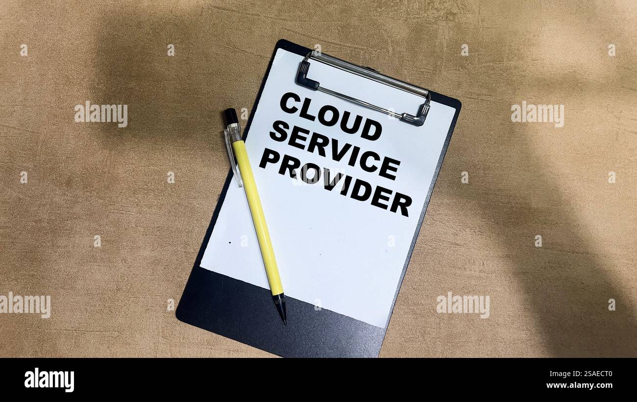 Concept of Cloud Service Provider write on paperwork isolated on Wooden Table. Stock Photo