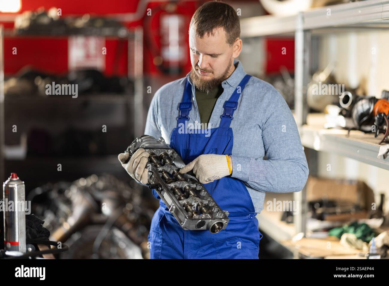 Man professional auto mechanic repairing car engine in garage Stock ...