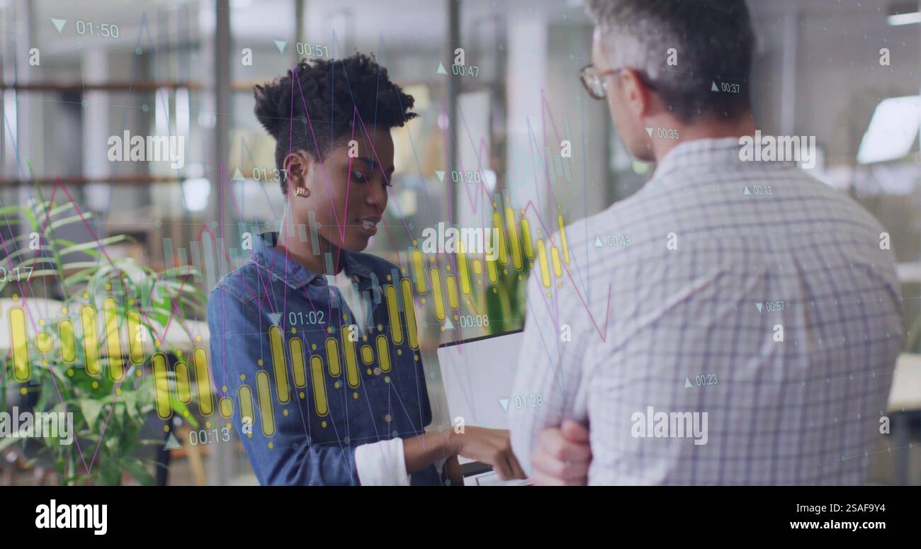 Image of diagram and data processing over diverse colleagues using ...