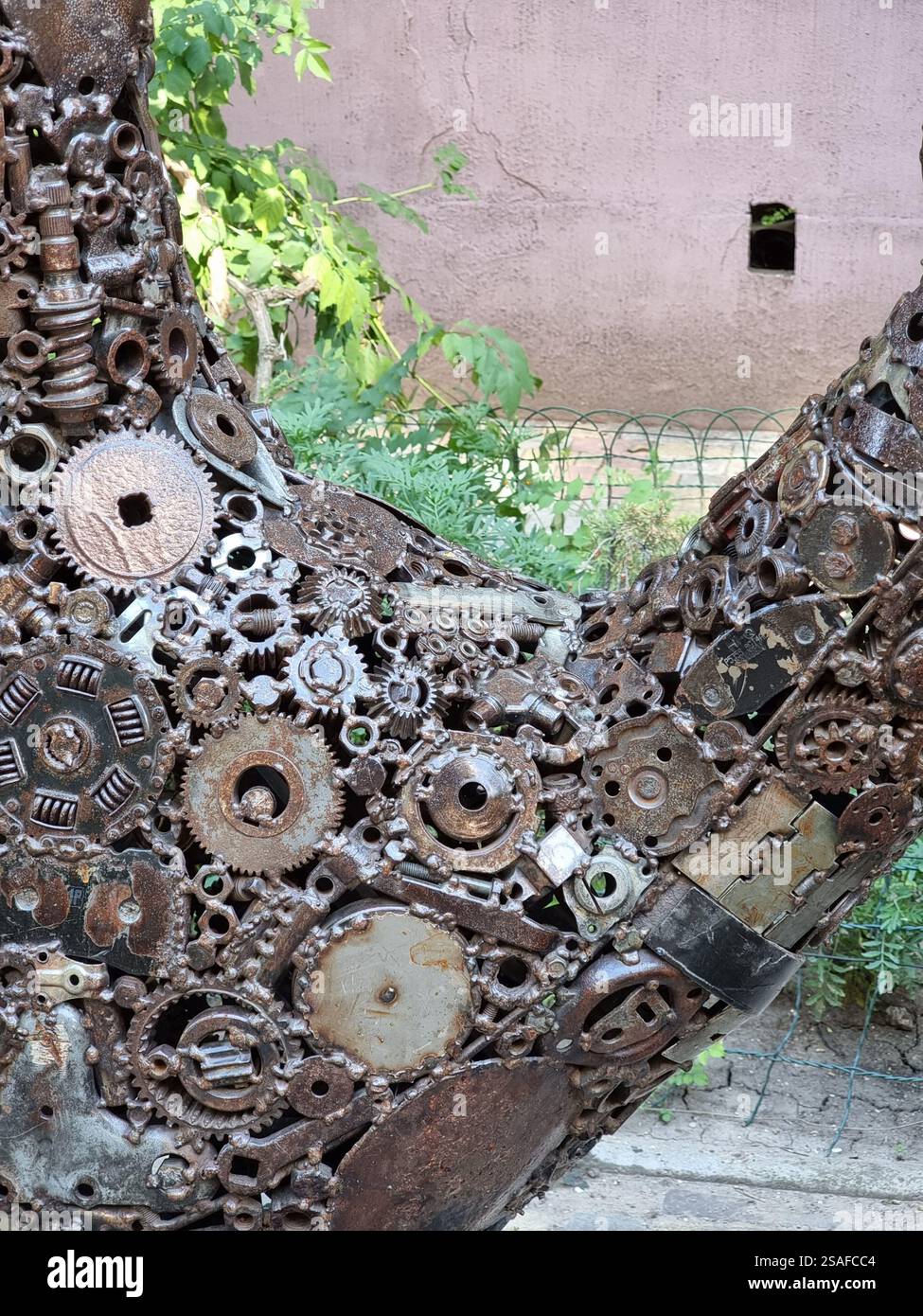 Closeup of the Monument to Steve Jobs in Odesa (Odessa ), Ukraine; a hand comprised of many metal gear wheels and other parts - Smartphone Captured Stock Image