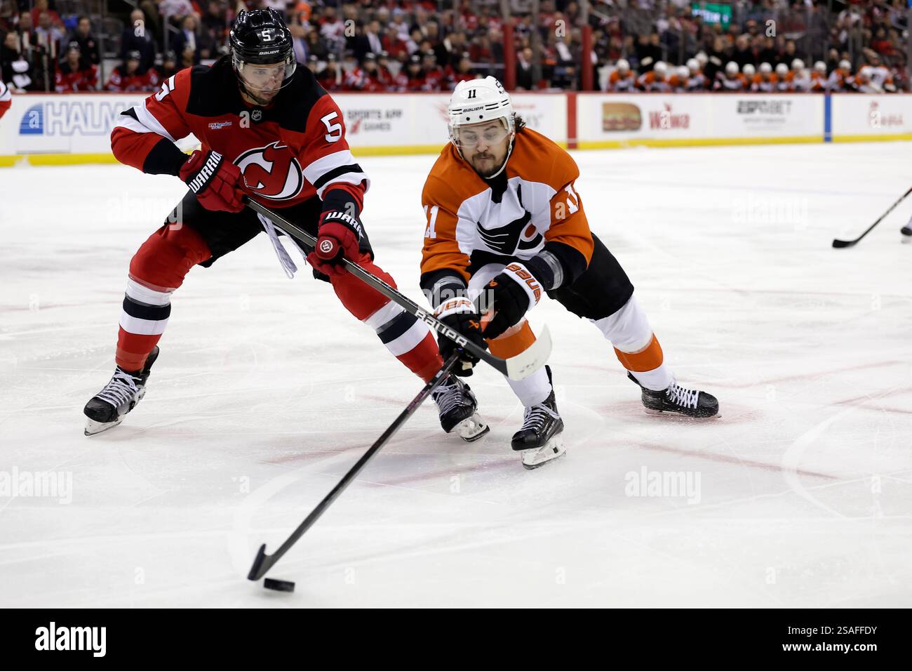 Philadelphia Flyers right wing Travis Konecny (11) battles for the puck