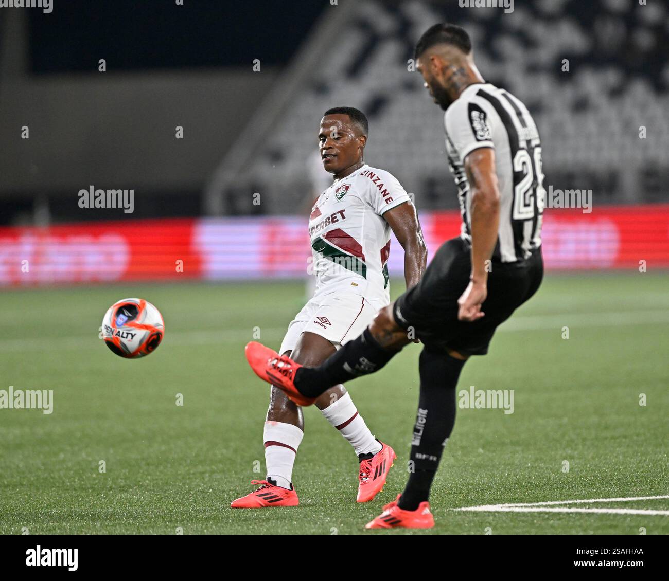 Rio De Janeiro, Brazil. 29th Jan, 2025. Jhon Arias of Fluminense challenges Alexander Barboza of Botafogo during the Campeonato Carioca 2025 football match between Botafogo and Fluminense at the Nilton Santos Stadium on January 29, 2025 in Rio de Janeiro, Brazil. (Andre Ricardo/Sports Press Photo/SPP) Credit: SPP Sport Press Photo. /Alamy Live News Stock Photo