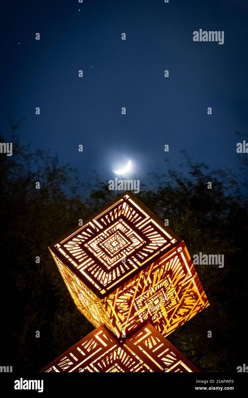 A nighttime view of intricate geometric light sculptures by HYBYCOZO ...