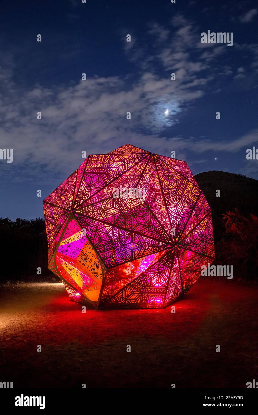 A nighttime view of intricate geometric light sculptures by HYBYCOZO ...