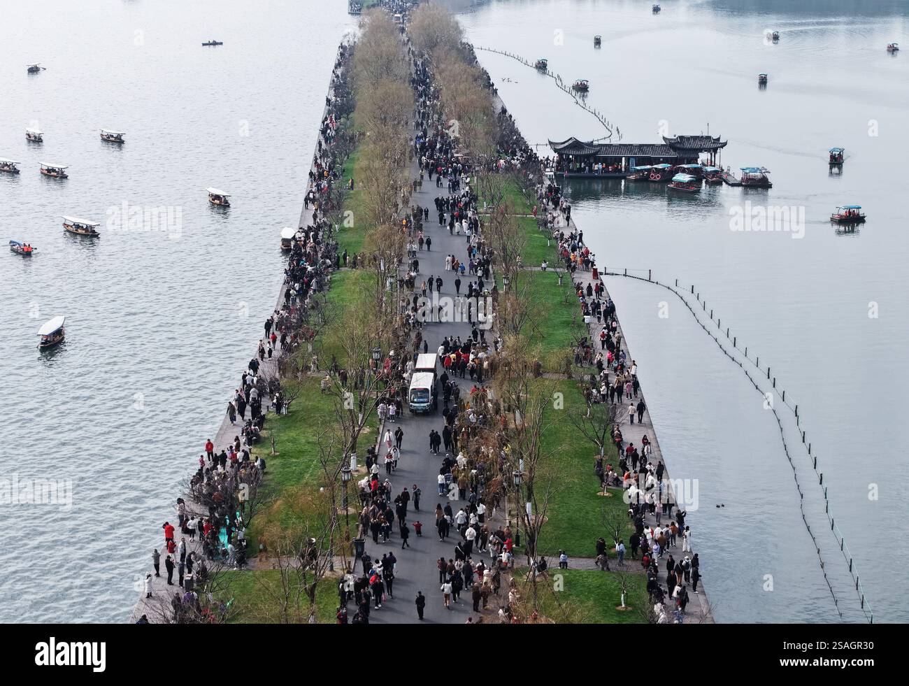 Tourists visit the West Lake scenic area during the Spring Festival