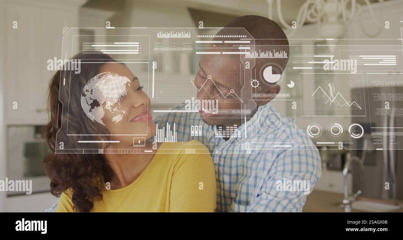 Image of financial data processing over biracial couple in kitchen Stock Photo