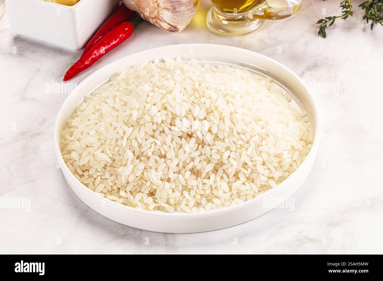 Dry raw Arborio rice for risotto Stock Photo - Alamy