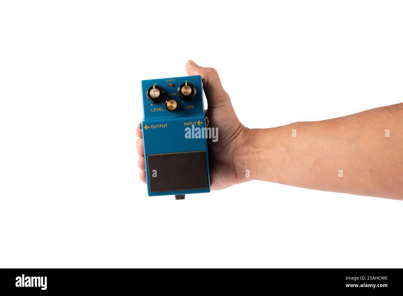 Male hand holding blue guitar effects pedal isolated on white background cutout Stock Photo