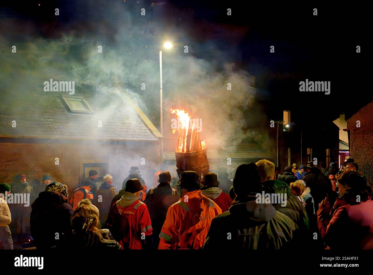 Burghead Moray Scotland dense smoke a crowd gathered around the burning clavie Stock Photo