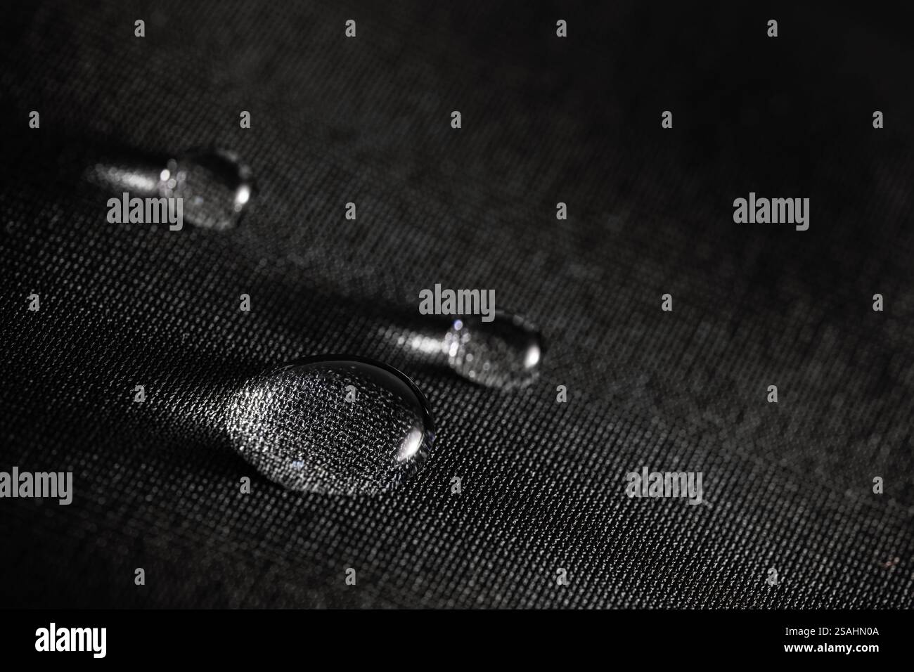 Many water drops on waterproof impregnated fabric. Stock Photo