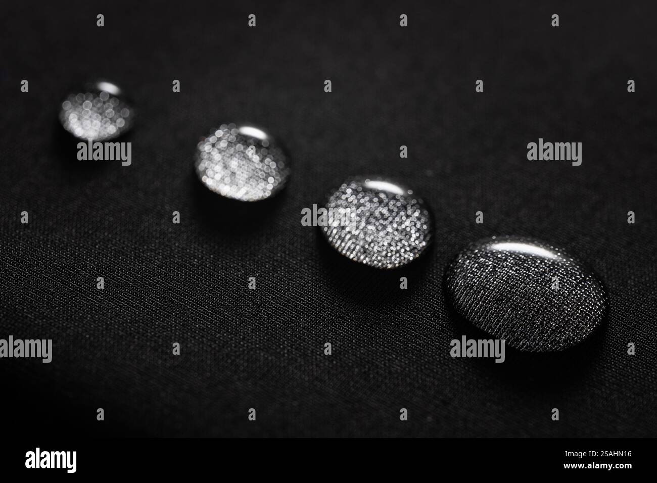 Many water drops on waterproof impregnated fabric. Stock Photo