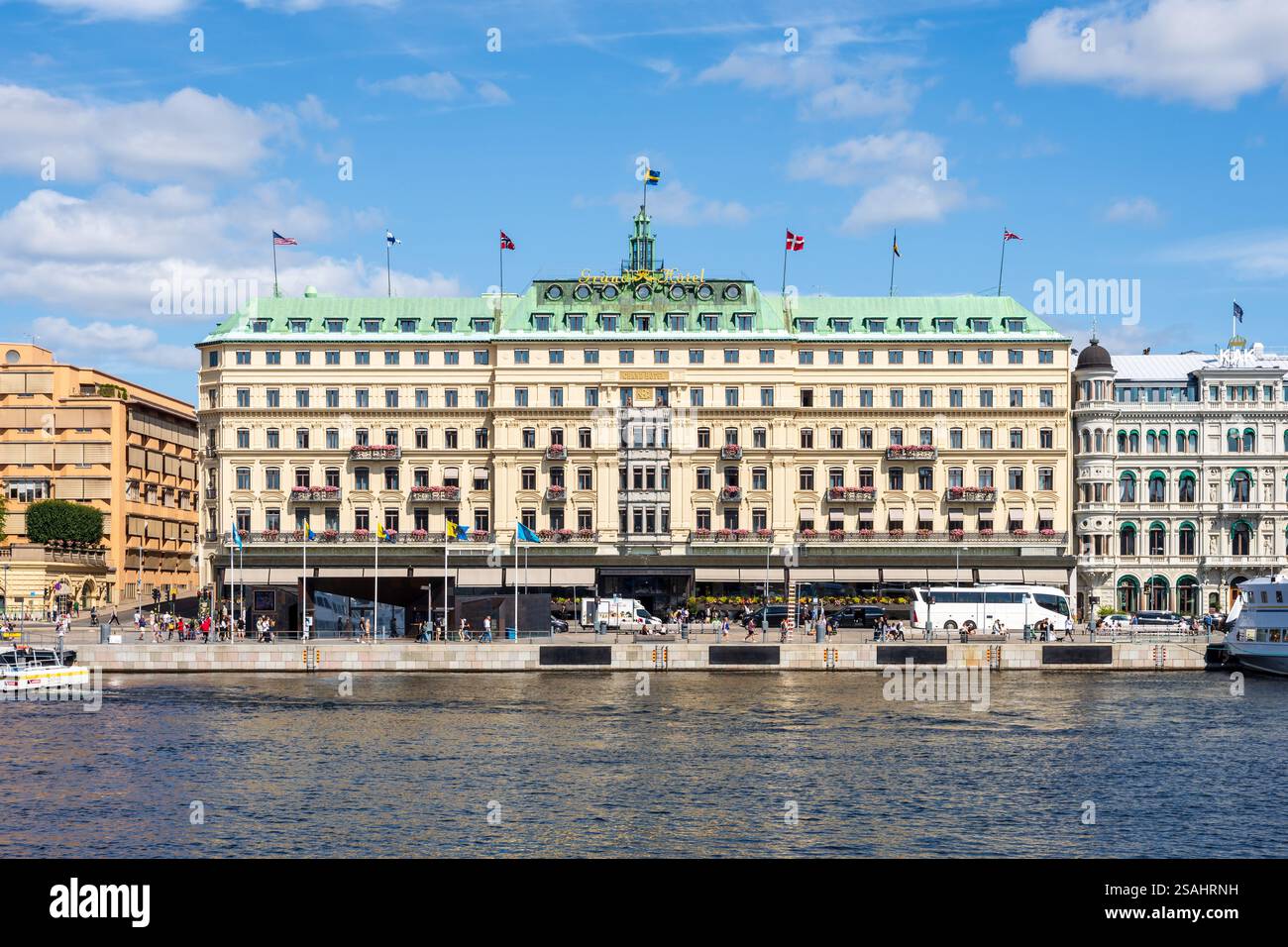 Facade of the Grand Hotel, a luxury five-star hotel located on the peninsula Blasieholmen in Stockholm, Sweden, on a sunny summer day. Stock Photo