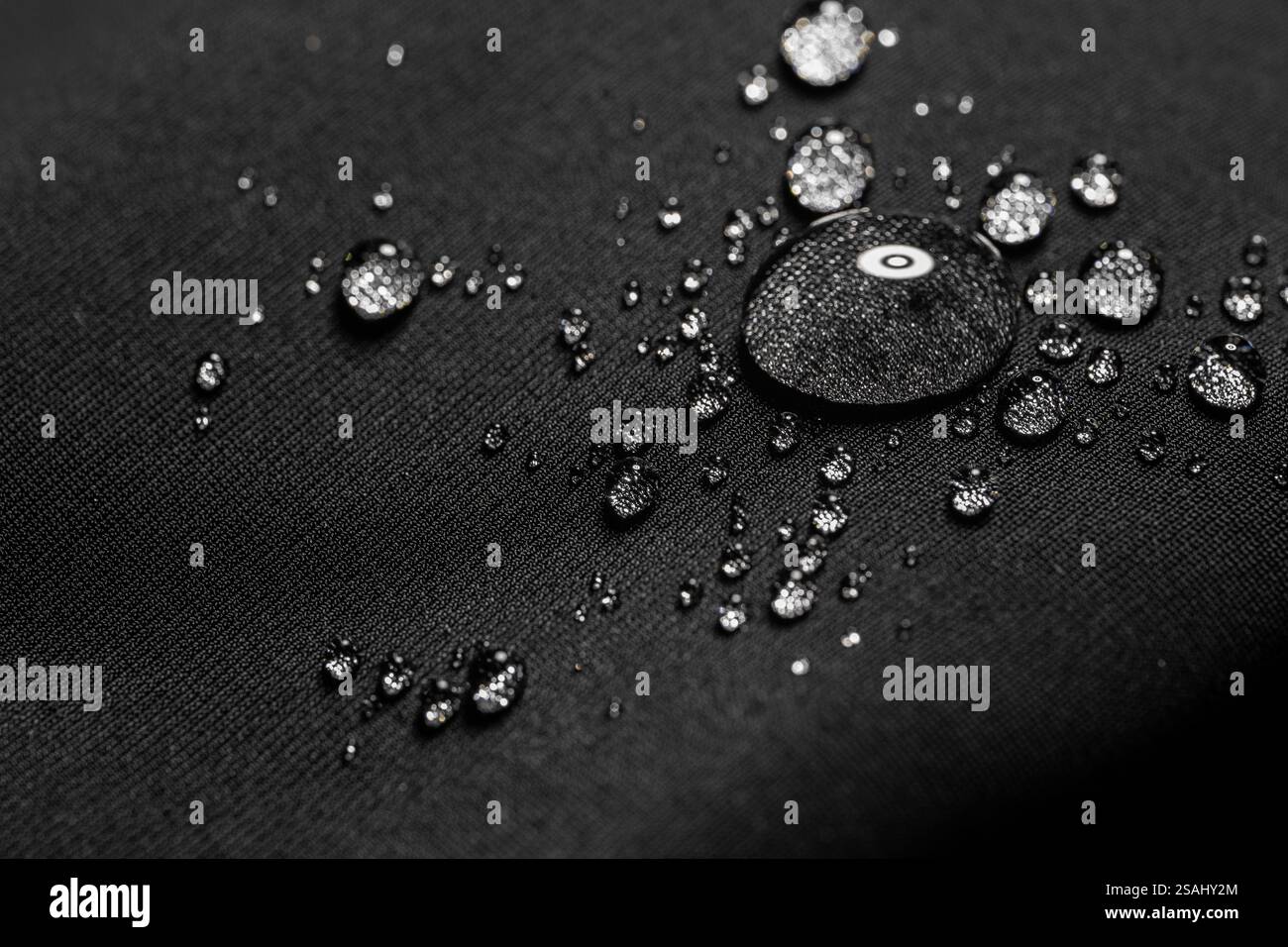 Many water drops on waterproof impregnated fabric. Stock Photo