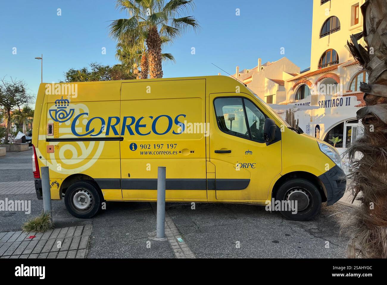 Yellow Correos Mail Van parked in Playa de las Américas. Arona, Tenerife. Canary Islands, Spain. 15th January 2025. - Smartphone Captured Stock Image