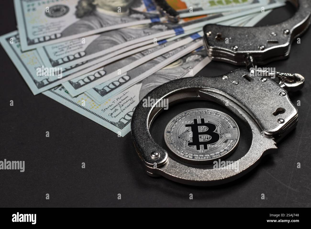 Bitcoin on dollar banknotes. One hundred dollar bills spread out. Gold and  silver bitcoin coins. Cryptocurrency trading concept Stock Photo - Alamy