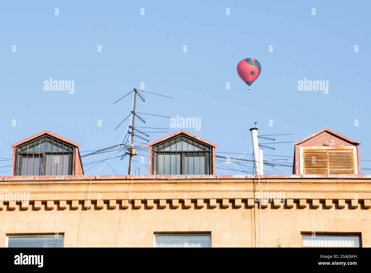 Colorful hot air balloon soaring in a clear blue sky during a sunny day ...