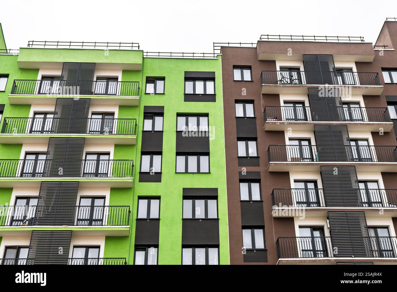 Photo inspiration: Fresh Look at Modern Apartment Buildings With Green And Brown Facades Large Windows