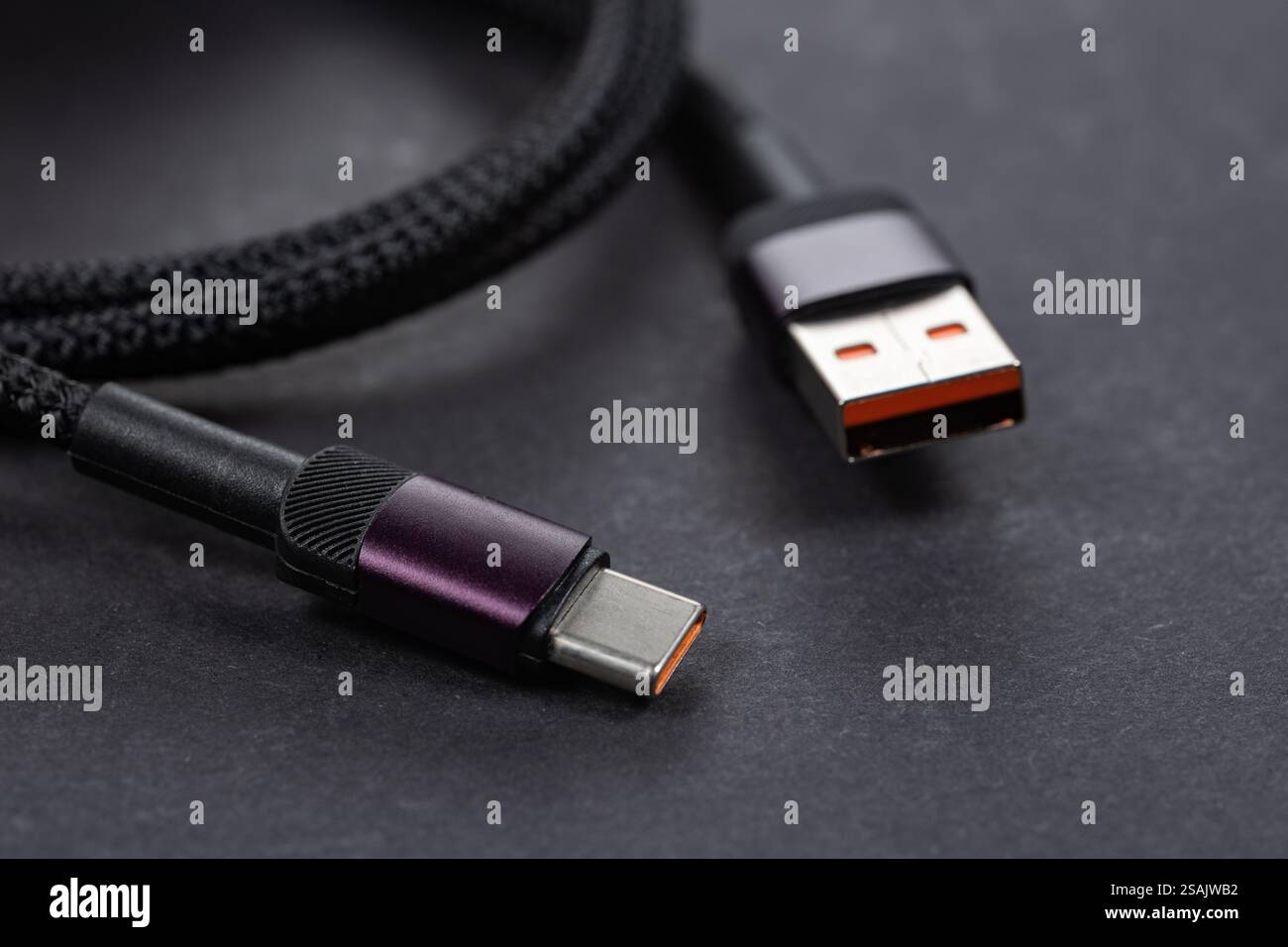 USB type A, USB type C cable on dark background. Stock Photo