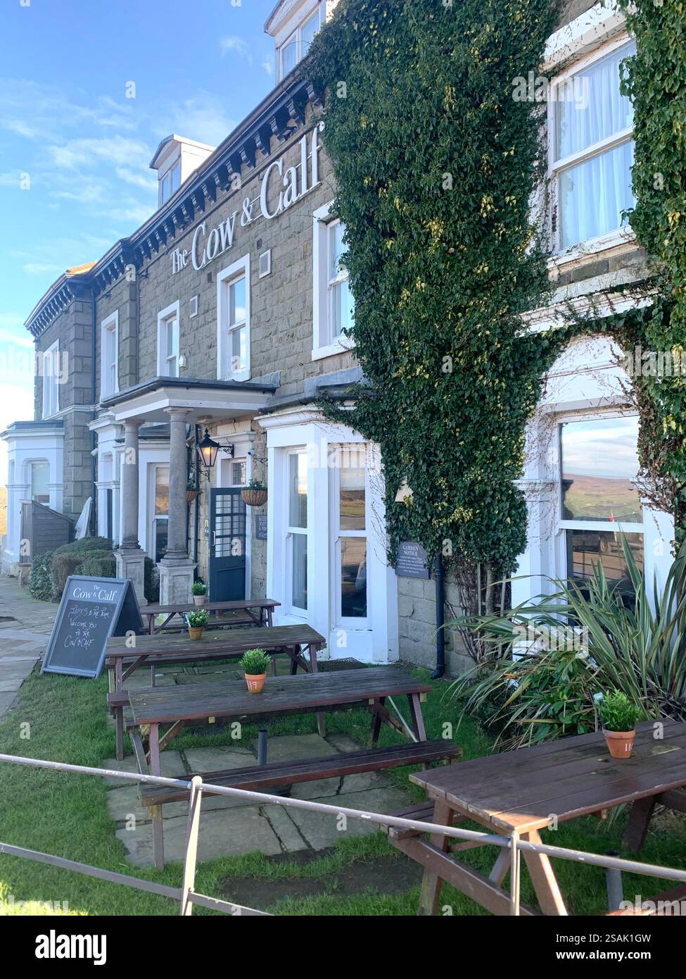 Ilkley Moor Yorkshire UK Britain England shop shops W H Smith Restaurant Pub bar food eat eating outside wet weather stone buildings old fashioned - Smartphone Captured Stock Image