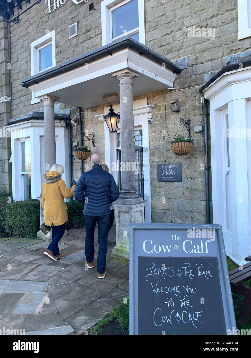 Ilkley Moor Yorkshire UK Britain England shop shops W H Smith Restaurant Pub bar food eat eating outside wet weather stone buildings old fashioned - Smartphone Captured Stock Image