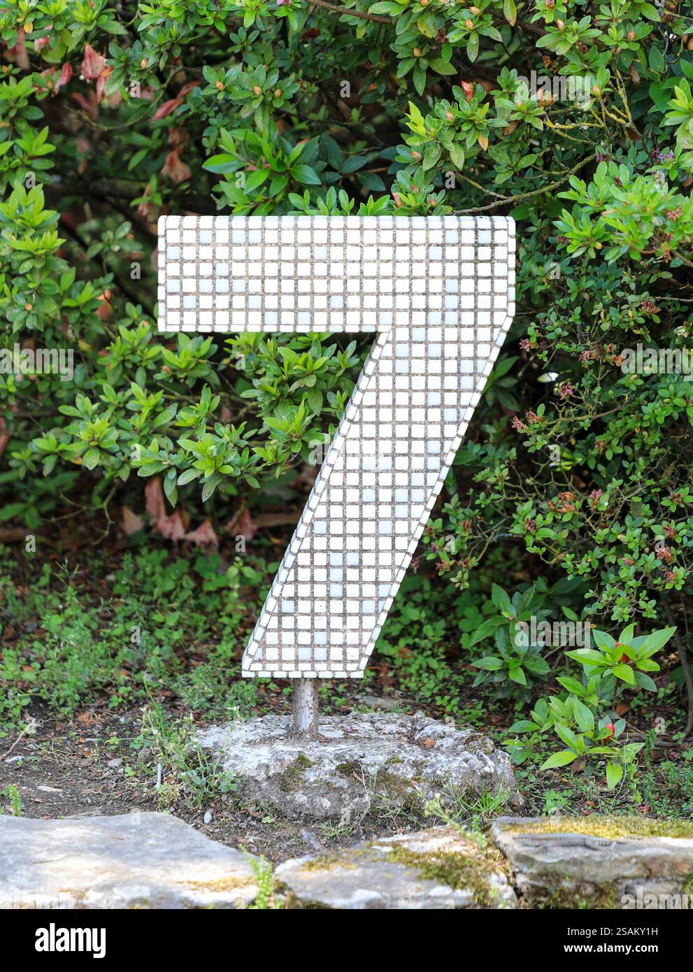 A numeral or number 7 or seven made out of coloured mosaic tiles Stock Photo