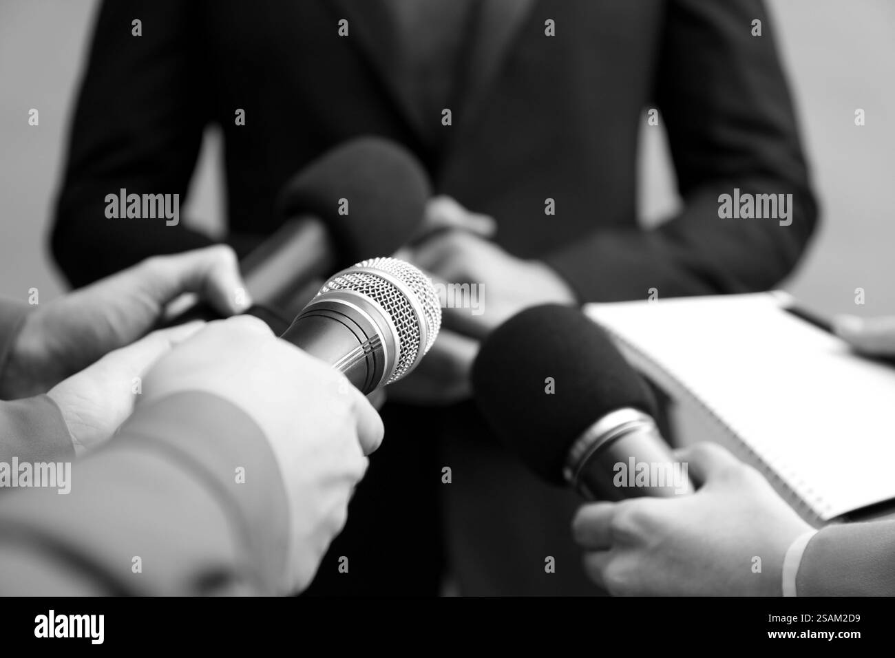 Businessman many hands in Black and White Stock Photos & Images - Alamy