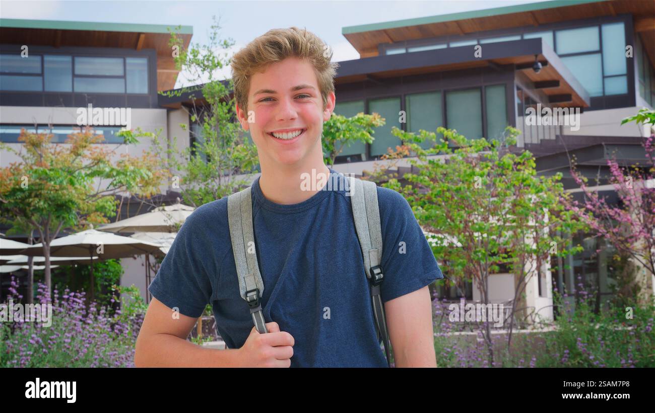 Portrait Of Smiling Teenage Male High School Student Outside College Or ...