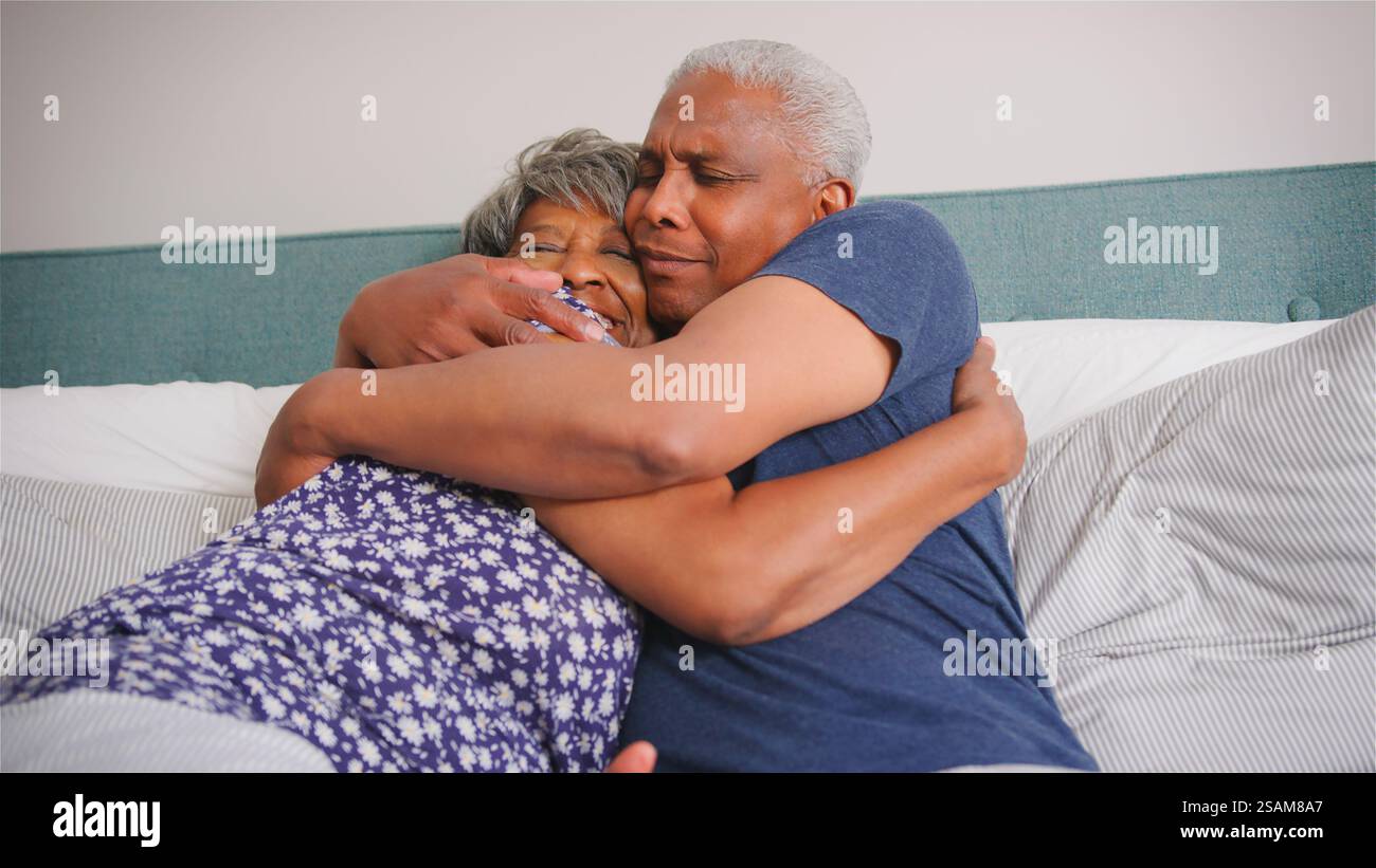 Black couple kissing in bed hi-res stock photography and images - Alamy