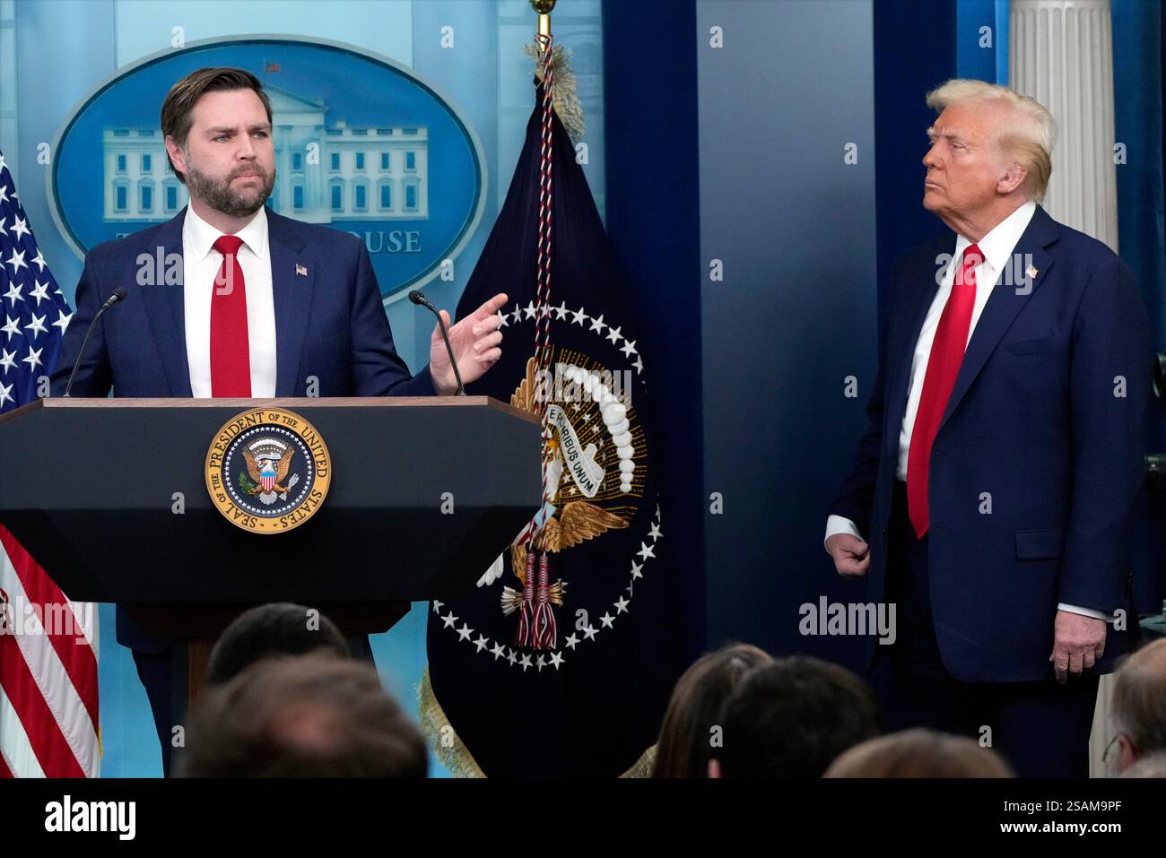 President Donald Trump listens as Vice President JD Vance speaks in the ...